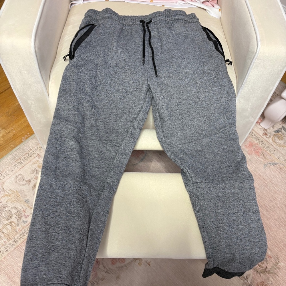 Gray sweatpants . Size large . Zipper pockets